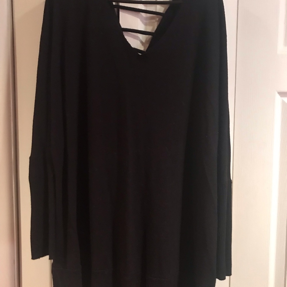 Black sweater with grid back at top